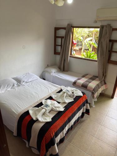 En eller flere senge i et værelse på Centro Resort