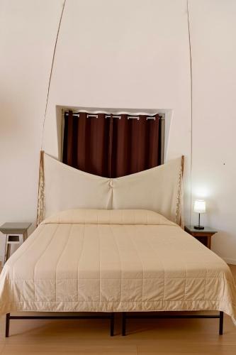 Ένα ή περισσότερα κρεβάτια σε δωμάτιο στο Casa Galileo