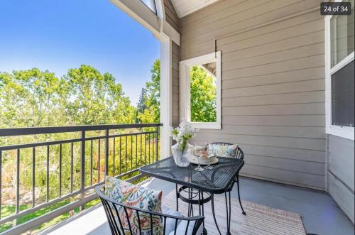 a patio with a table and chairs on a balcony at Cozy Contemporary one big bedroom in the Palo Alto area, close to Stanford, CA, a nice & relaxing place in Palo Alto