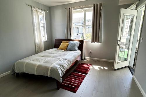 a bedroom with a bed and a window at Big one bedroom in the Palo Alto, close to Stanford, CA USA -Newly remodeled, Nice Relaxing Place in Palo Alto