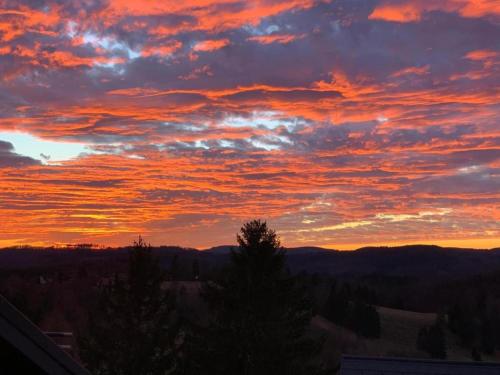 a sunset from the balcony of a house at Einfamilienhaus in Zorge in Zorge