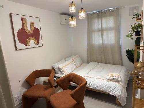 Ένα ή περισσότερα κρεβάτια σε δωμάτιο στο Cozy Studio Retreat in Croydon