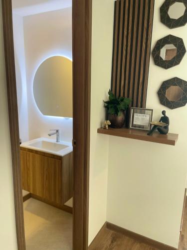 a bathroom with a sink and a mirror at Casa en Ambato in Ambato