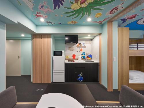 a room with a kitchen with a ceiling with fish on it at MIMARU Kyoto Shinmachi Sanjo in Kyoto