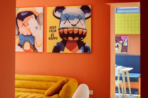 a room with three paintings of a cow on the wall at Mr. Gao and Ms. Feng's original homestay in Waxie
