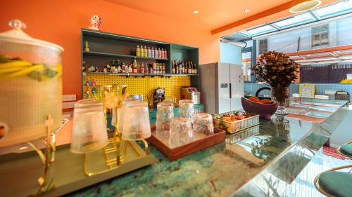 a kitchen with a counter with many glass jars at Mr. Gao and Ms. Feng's original homestay in Waxie