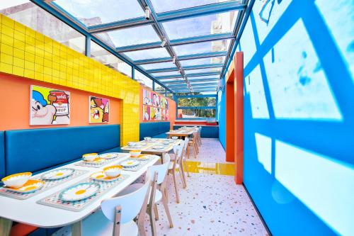 a dining room with tables and chairs at Mr. Gao and Ms. Feng's original homestay in Waxie