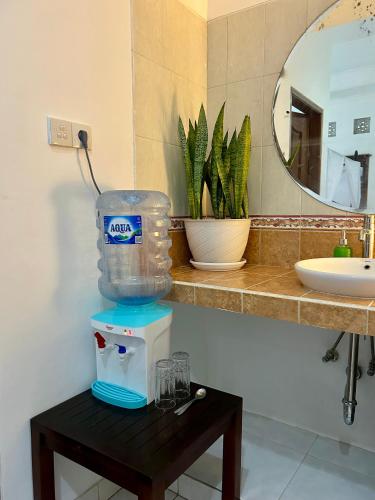 a bathroom with a blender on a table next to a sink at Will and Ray's at Lori Beach Inn in Seminyak