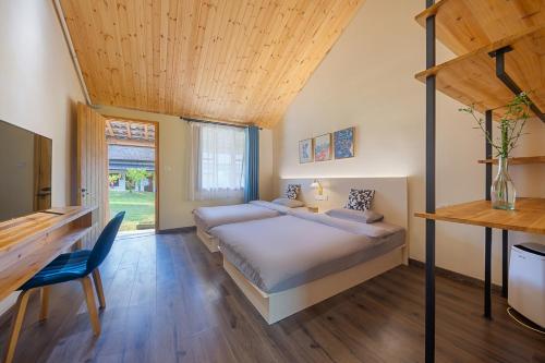a bedroom with a bed and a wooden ceiling at Floral Moganshan Natural Residence Pet Resort B&B in Huzhou