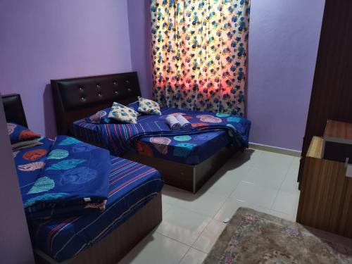 Кровать или кровати в номере Quddus Inn villa