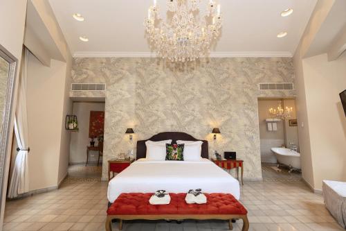 Un ou plusieurs lits dans un hébergement de l'établissement La Concordia - Boutique Hotel