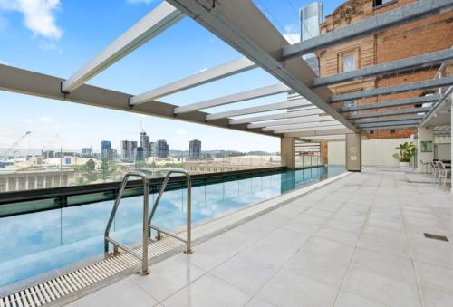 a roof deck with a view of the city at Coastal Escape with River Views in Casino Towers in Brisbane
