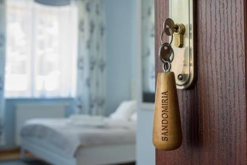a door knob with the words door open on it at Sandomiria in Sandomierz