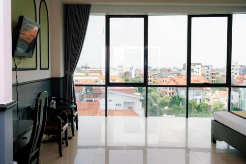 a living room with a view of a city at Khách sạn Đại An Ninh Bình in Ninh Binh