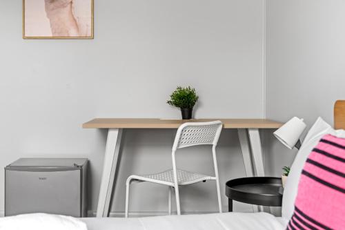a bedroom with a desk with a chair and a bed at Affordable Double Bedroom - Heart of Belmore with Shared Bathroom in Sydney