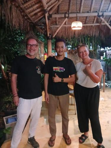 a group of three people standing next to each other at Yoga Lover in Yogyakarta