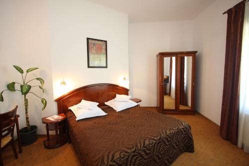 Ένα ή περισσότερα κρεβάτια σε δωμάτιο στο Hotel Ruia