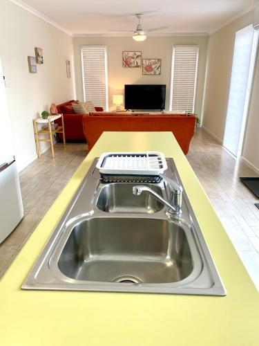 a kitchen sink with a keyboard on top of it at River Retreat in American River