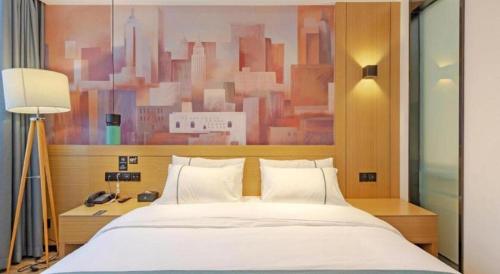 Letto o letti in una camera di City Comfort Inn Taizhou International Exhibition Center
