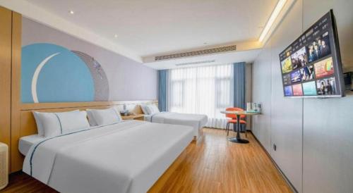 Postel nebo postele na pokoji v ubytování City Comfort Inn Zhanjiang Xuwen Port Wharf Passenger Station