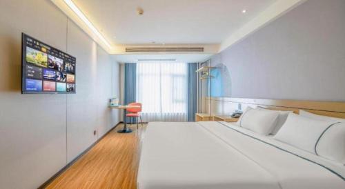 Postel nebo postele na pokoji v ubytování City Comfort Inn Zhanjiang Xuwen Port Wharf Passenger Station