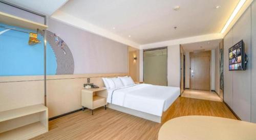 Postel nebo postele na pokoji v ubytování City Comfort Inn Zhanjiang Xuwen Port Wharf Passenger Station
