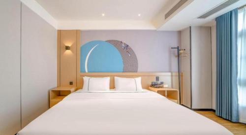 Postel nebo postele na pokoji v ubytování City Comfort Inn Zhanjiang Xuwen Port Wharf Passenger Station