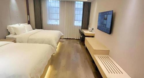Letto o letti in una camera di Lavande Hotels Jinzhong Youjian Pingyao