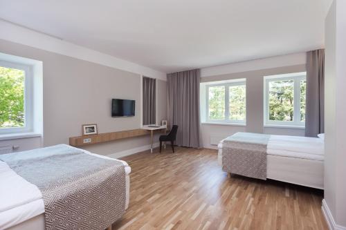 Una cama o camas en una habitación de Rannahotell