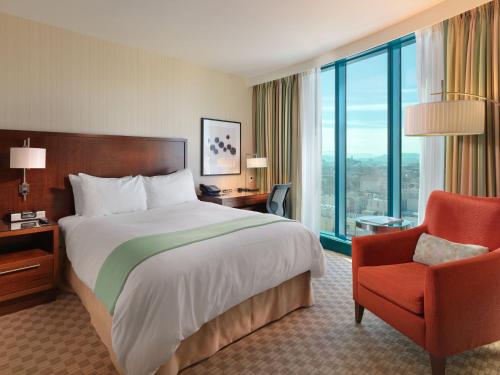 a hotel room with a bed and a chair at InterContinental San Francisco by IHG in San Francisco