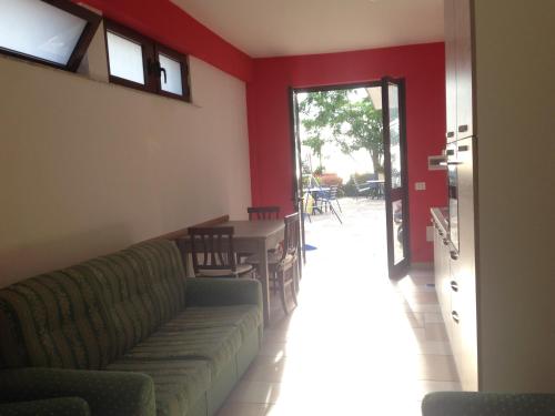 a living room with a couch and a table at Villa Malandrino Guest House in Agropoli