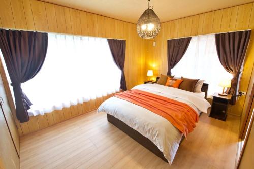 En eller flere senge i et værelse på Resort Villa N&N