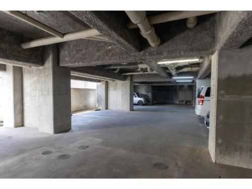 an empty parking garage with a van parked in it at Hotel WWJ - Vacation STAY 82120v in Ina