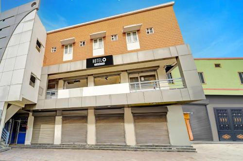 a building with a sign that reads villa at Super Hotel O Dindugal Bus Terminal Formerly GK Building in Dindigul
