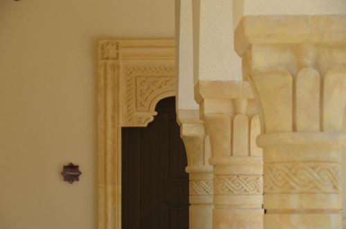a doorway to a building with a black door at RIAD Comfort Rooms in San Vito lo Capo