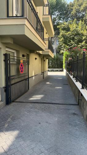 a building with a gate with a no parking sign on it at 8th Hill Apartments in Plovdiv