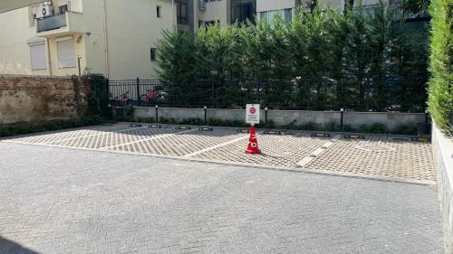 a red cone sitting in the middle of a street at 8th Hill Apartments in Plovdiv