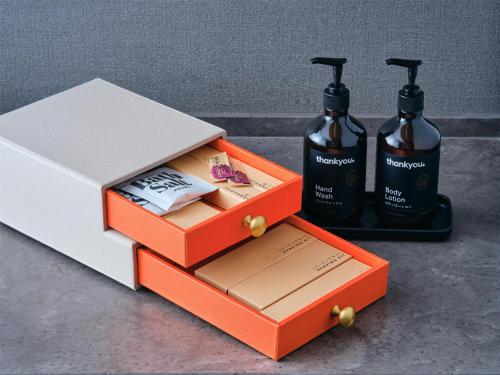 a couple of boxes with bottles of soap and a box at Canopy By Hilton Osaka Umeda in Osaka