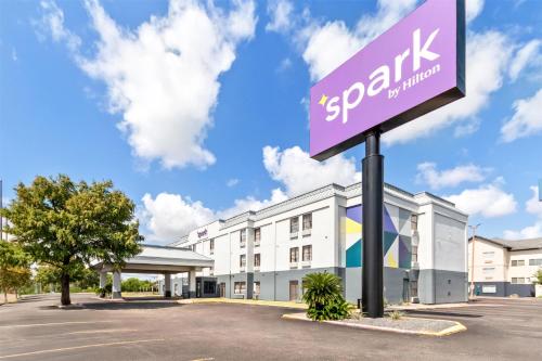 a sign in front of a building at Spark By Hilton Corpus Christi Southeast in Corpus Christi