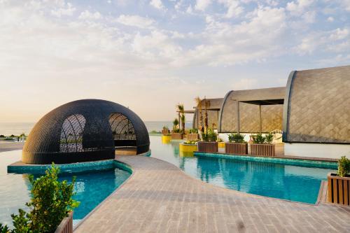 a pool at a resort with blue water at Caspi Mayr in Baku