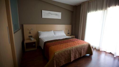 Ліжко або ліжка в номері Hotel Vilar Riu de Baix