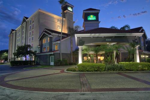 a hotel with a clock tower on top of a building at La Quinta by Wyndham Orlando I Drive/Conv Center in Orlando