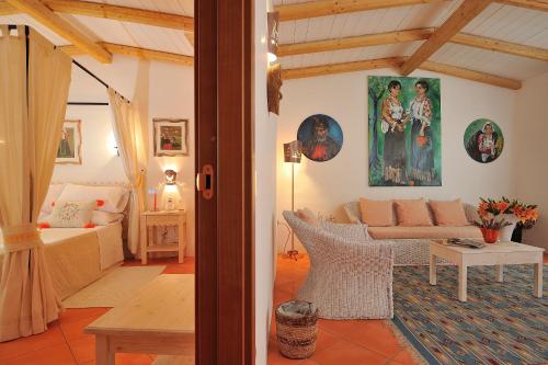 a living room with a couch and a table at HOTEL ORLANDO Sardegna in Villagrande Strisaili