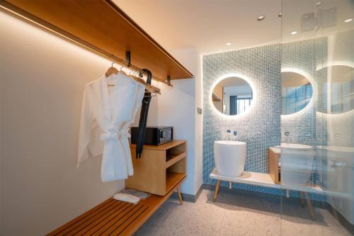 a bathroom with a sink and a mirror at Wyndham Garden Phuket Kamala in Kamala Beach