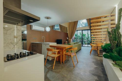 a kitchen and dining room with a table and chairs at Moon Rock Villas in Darmasaba