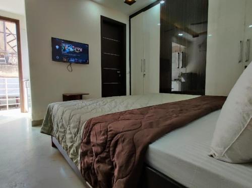 Ένα ή περισσότερα κρεβάτια σε δωμάτιο στο Living lodge hotel