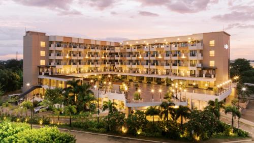 an exterior view of a hotel at night at SixtyFifth Destination Resort Hotel in Bacolod