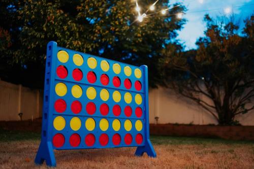a blue and red giant checker board in a yard at 5040 Sqft l Sleeps 25 l Near Ski & Downtown SLC in West Jordan