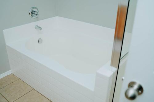 a bathroom with a shower with a glass door at 5040 Sqft l Sleeps 25 l Near Ski & Downtown SLC in West Jordan