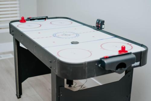 a ping pong table with red balls on it at 5040 Sqft l Sleeps 25 l Near Ski & Downtown SLC in West Jordan